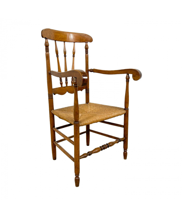 Antique oak and elm wooden armchair with cane seat