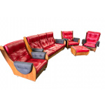 G Plan solid teak suite, featuring a Saddleback sofa, three armchairs and a puffet