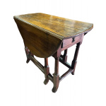 Antique oak stretchered drop leaf oval table