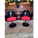 Pair of black retro style swivel tub chairs