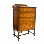 Narrow Oak Chest of Drawers with Art Deco Carving