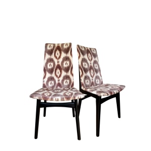 Two accent mid century Teak framed chairs reupholstered in seventies inspired velvet Ikat print.